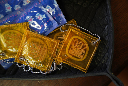 RAW PIG SKIN CONDOM CHARM FOR BAG / YELLOW